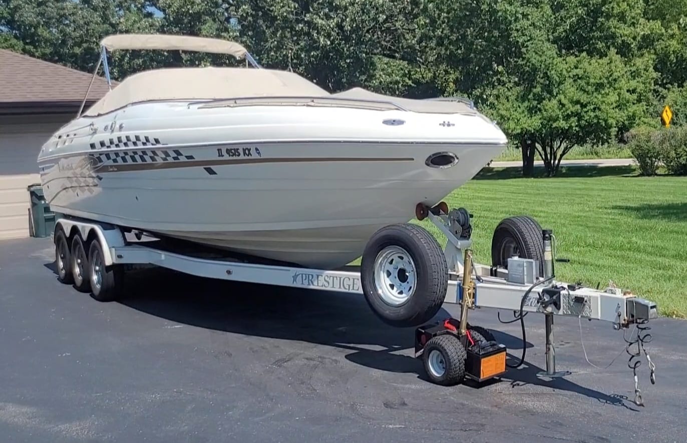 white speed boat on boat trailer using wireless eezi trailer mover