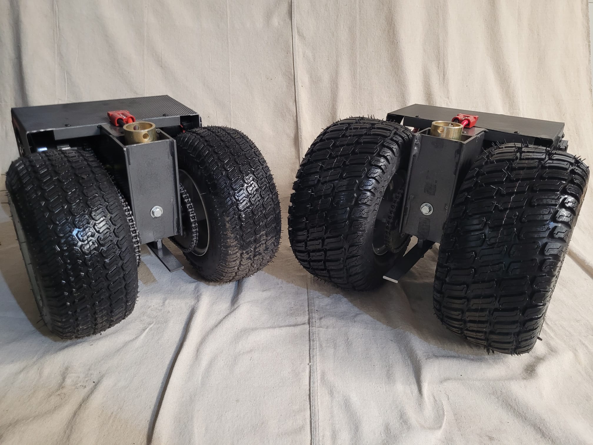 Back view of two wireless remote controlled trailer mover dollies